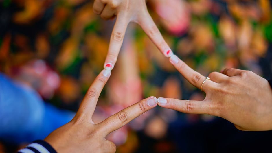 Close-up of hands forming a star shape, symbolizing unity and friendship.